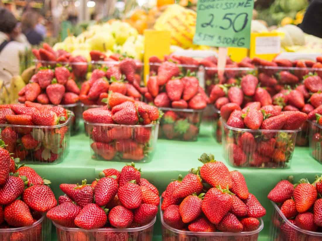 Delicious Basilicata strawberries in April at the Mercato delle Erbe, Bologna, Italy