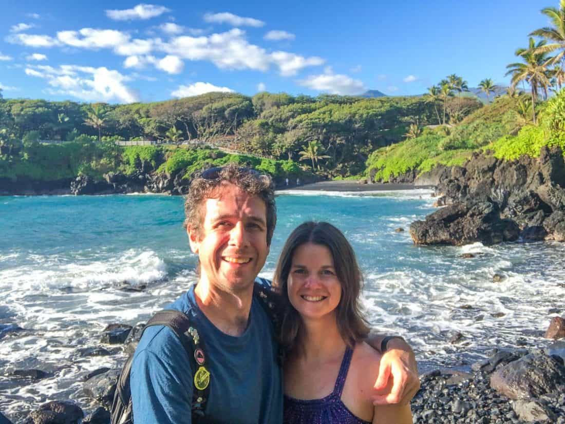 Simon and Erin at Wai‘anapanapa State Park with the black sand beach in the background, Maui, Hawaii, USA