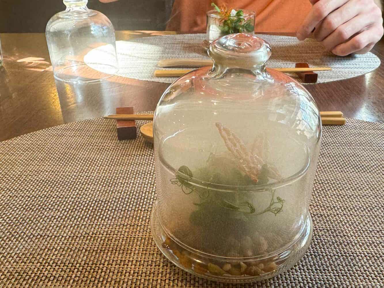 Smoked salad served in a glass jar at Saido vegan restaurant in Tokyo