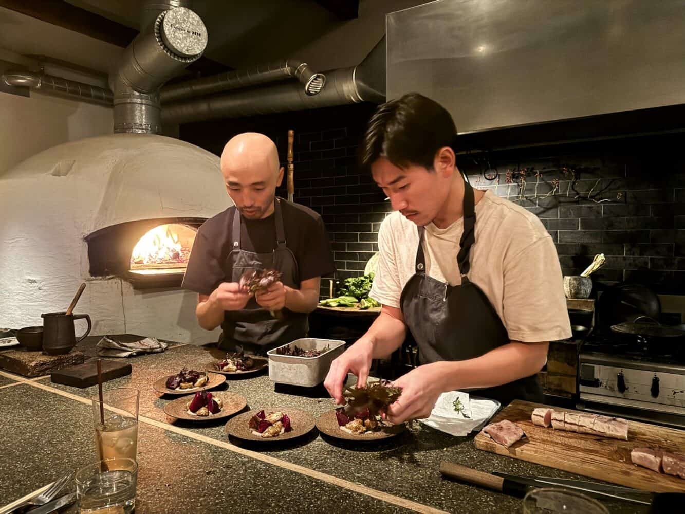 Chefs working silently in Monk Restaurant, Kyoto, Japan