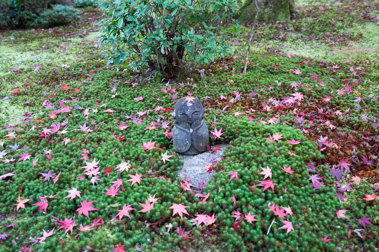 Small buddha in Enkoji garden in autumn, Kyoto, Japan