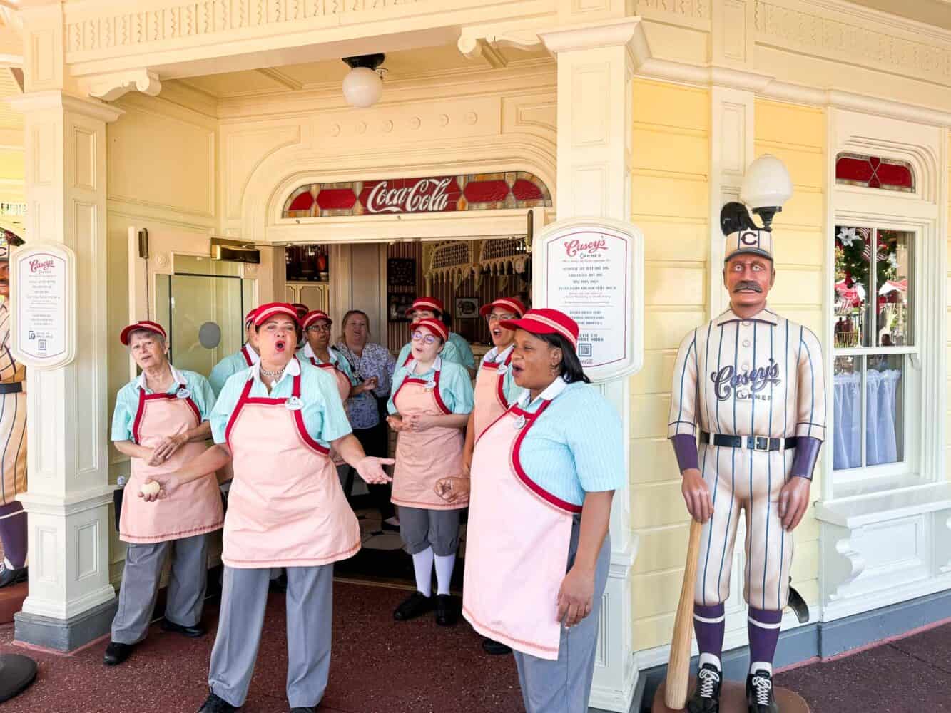 Cast members at Casey's Corner in Magic Kingdom singing at opening