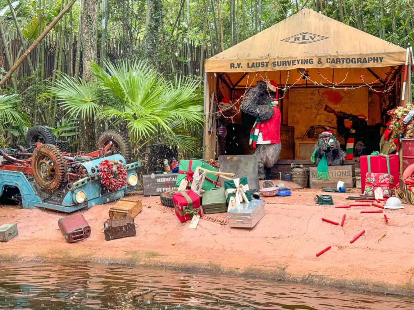 Jingle Cruise Christmas overlay of Jungle Cruise ride at Magic Kingdom featuring animals dressed as Santa.