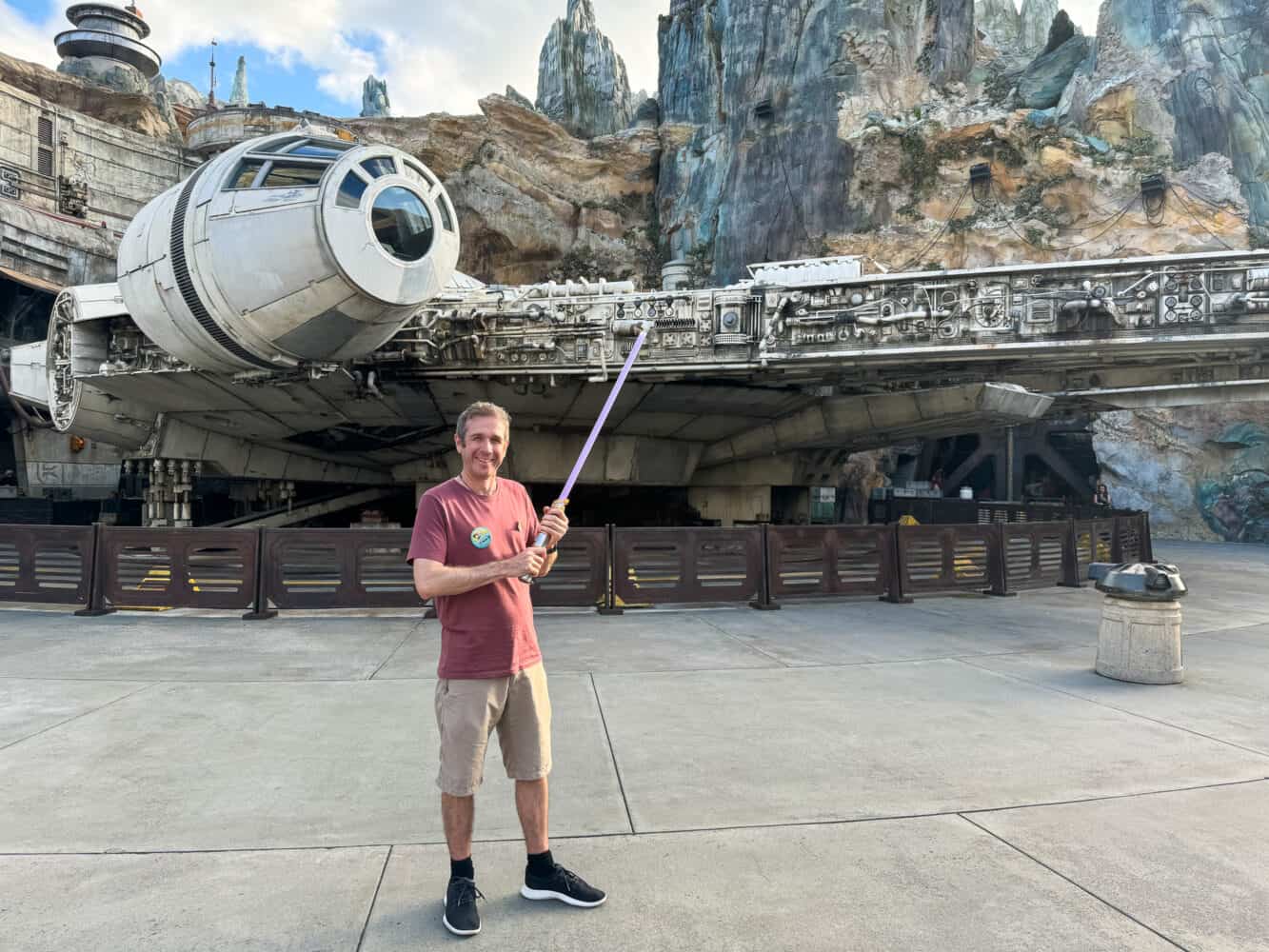 Simon with lightsaber outside Millennium Falcon ride at Hollywood Studios, Disney World