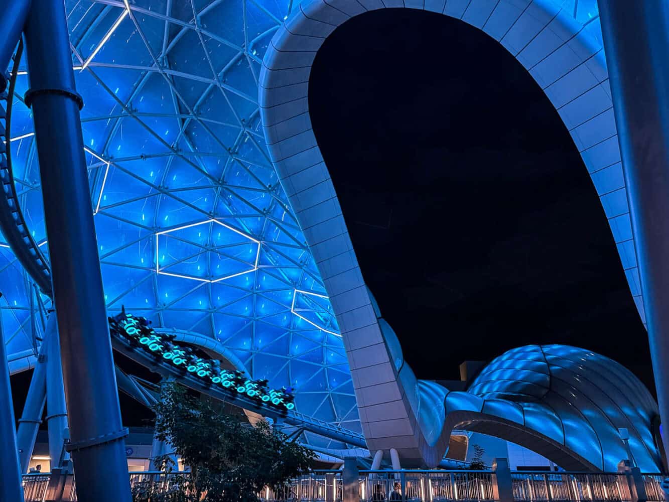 Tron Lightcycle Run rollercoaster at Magic Kingdom at night