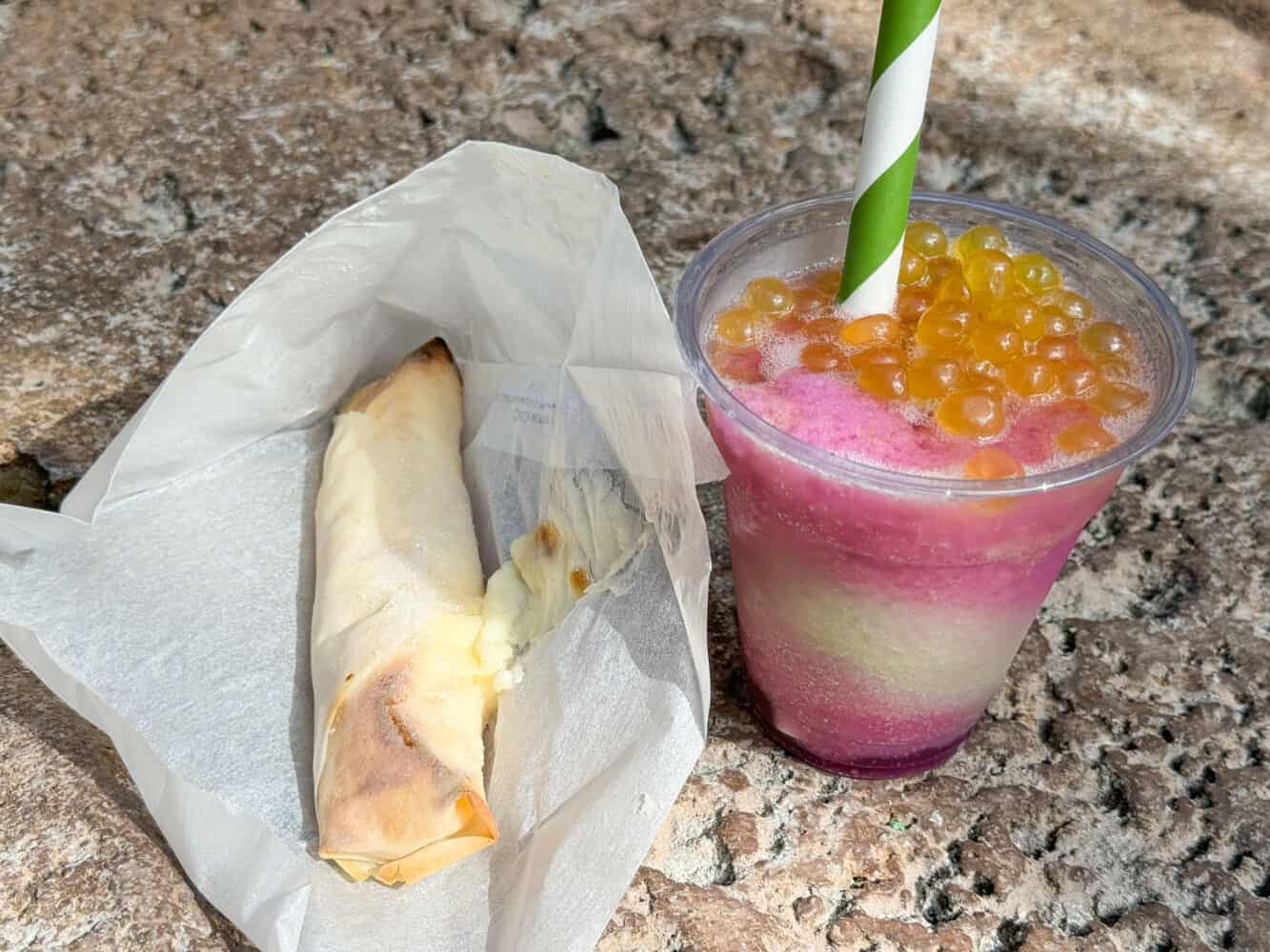 Pineapple Lumpia and Rum Blossom cocktail from Pongu Pongu stand in Pandora in Animal Kingdom.