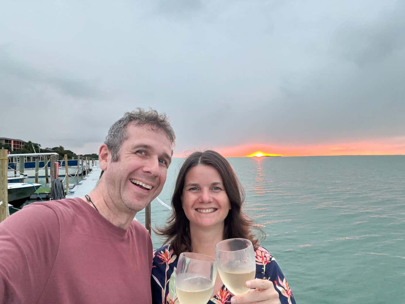 Simon and Erin having a sunset toast on the dock at Baker's Cay Resort Key Largo