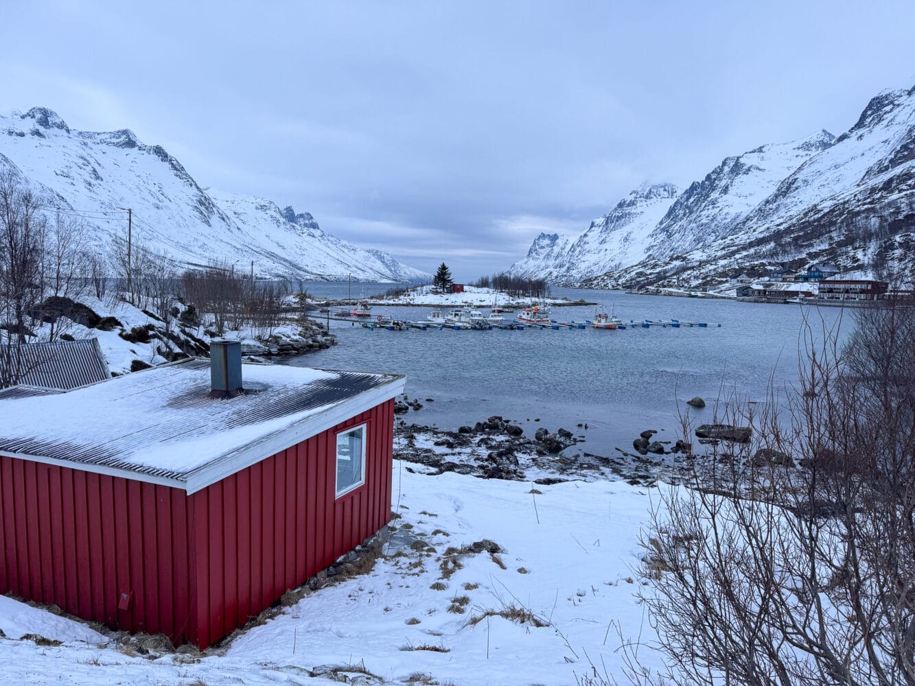 Fishing boats and snowy mountains at Ersfjord, Ersfjordbotn, Kvaloya, Norway