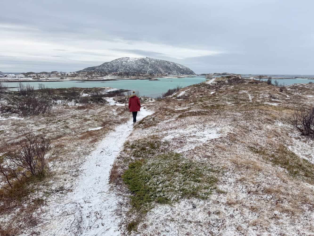 Simon walking along a frosty path in Steinsvika, Sommaroy in Norway