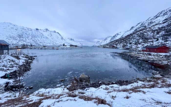 Snowy Ersfjordbotn village and fjord in Kvaloya Island, near Tromso, Norway.